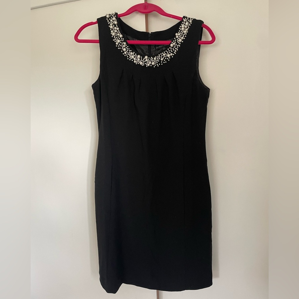 Sandra Darren little black dress with pockets and pearl details